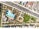 Aerial view of a community pool and playground surrounded by modern homes and lush landscaping at 3216 Monte Luna Ave, Henderson, NV 89044