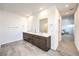 Bright bathroom with double sinks, sleek vanities, modern tile flooring, and recessed lighting, offering a clean design at 3216 Monte Luna Ave, Henderson, NV 89044