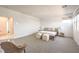 Spacious bedroom with neutral carpeting and a large bed, complemented by natural light from the windows at 3216 Monte Luna Ave, Henderson, NV 89044