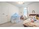 Cozy bedroom features a play tent, desk area, comfortable bed, and plush carpet at 3216 Monte Luna Ave, Henderson, NV 89044