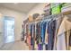 Walk-in closet with well-organized clothing racks and shelving, providing ample storage and organization at 3216 Monte Luna Ave, Henderson, NV 89044