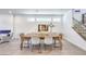 Modern dining room with designer chairs, fireplace, tile flooring, and contemporary decor at 3216 Monte Luna Ave, Henderson, NV 89044