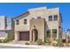 Contemporary two-story home featuring desert landscaping, a two-car garage, and a welcoming front entry at 3216 Monte Luna Ave, Henderson, NV 89044