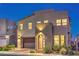 Beautiful two-story home at night with attractive exterior lighting and modern architecture at 3216 Monte Luna Ave, Henderson, NV 89044