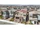 Contemporary two-story home with a tile roof, complemented by desert landscaping for a modern curb appeal at 3216 Monte Luna Ave, Henderson, NV 89044