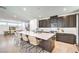 Modern kitchen featuring large island with seating and stainless steel appliances at 3216 Monte Luna Ave, Henderson, NV 89044