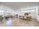 Bright, open-concept living and dining area with modern fireplace and recessed lighting at 3216 Monte Luna Ave, Henderson, NV 89044