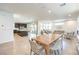 Open-concept living space with large kitchen island and a dining area leading into a living room at 3216 Monte Luna Ave, Henderson, NV 89044