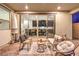 Inviting patio area features wicker furniture, an umbrella and view to the kitchen at 3216 Monte Luna Ave, Henderson, NV 89044