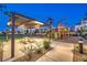 Playground with picnic and play area lit up during the early evening hours at 3216 Monte Luna Ave, Henderson, NV 89044