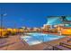 Large community pool with accessible ramps and ample seating surrounded by modern architecture at 3216 Monte Luna Ave, Henderson, NV 89044