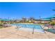 Resort-style pool with lounge chairs and sunshades, perfect for relaxation at 3216 Monte Luna Ave, Henderson, NV 89044