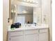 Bright bathroom featuring a large mirror, spacious vanity, and ample storage space at 3233 Kinsale Ct, Las Vegas, NV 89121
