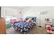 Bright bedroom with a comfortable bed, a window with blinds, and decor at 3233 Kinsale Ct, Las Vegas, NV 89121