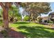 Picturesque green space with mature trees, and well-maintained landscaping at 3233 Kinsale Ct, Las Vegas, NV 89121