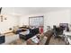 Cozy living room with natural light, carpet flooring, and comfortable seating at 3233 Kinsale Ct, Las Vegas, NV 89121