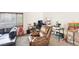 Inviting living room featuring carpet, a comfortable recliner, and a workspace at 3233 Kinsale Ct, Las Vegas, NV 89121
