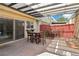 Inviting patio area with a pergola, dining set, and a sliding glass door at 3233 Kinsale Ct, Las Vegas, NV 89121
