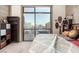 Bedroom showcases a skyline view from the expansive windows, with neutral carpet and modern fixtures at 353 E Bonneville Ave # 632, Las Vegas, NV 89101