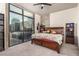 Primary bedroom features a large window with views, hardwood floors and modern decor at 353 E Bonneville Ave # 632, Las Vegas, NV 89101