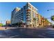 Modern apartment building with glass windows, balconies, and ground-level retail in an urban setting at 353 E Bonneville Ave # 632, Las Vegas, NV 89101
