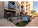 Apartment complex with patios, manicured landscaping, and benches for outdoor enjoyment at 353 E Bonneville Ave # 632, Las Vegas, NV 89101