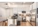 Bright kitchen featuring stainless steel appliances, marble backsplash, and hardwood floors at 353 E Bonneville Ave # 632, Las Vegas, NV 89101