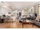 Open concept living space with kitchen, dining, and living area featuring modern design and hardwood floors at 353 E Bonneville Ave # 632, Las Vegas, NV 89101