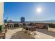 Enjoy city views from this rooftop patio furnished with a dining set and seating area at 353 E Bonneville Ave # 632, Las Vegas, NV 89101