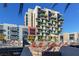 Stylish community pool area with lounge chairs and modern architecture in a vibrant setting at 353 E Bonneville Ave # 632, Las Vegas, NV 89101
