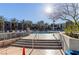 Beautiful pool area with palm trees, lounge chairs, and modern architectural design for relaxation at 353 E Bonneville Ave # 632, Las Vegas, NV 89101