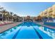 Community pool with lounge chairs and cabanas, providing a perfect setting for relaxation and recreation at 353 E Bonneville Ave # 632, Las Vegas, NV 89101