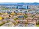 A high angle neighborhood view featuring a complex nearby with a mountain backdrop at 3696 Via Geneva, Henderson, NV 89052