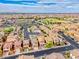 Wide overhead shot of a neighborhood and a nearby running track and stadium at 3696 Via Geneva, Henderson, NV 89052