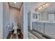 Bathroom with modern toilet, dual vanity and a glimpse into the walk-in closet at 3696 Via Geneva, Henderson, NV 89052