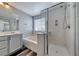 Bathroom features relaxing soaking tub, glass shower, and modern finishes at 3696 Via Geneva, Henderson, NV 89052