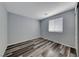 Bedroom with neutral paint, modern vinyl flooring and plenty of natural light at 3696 Via Geneva, Henderson, NV 89052
