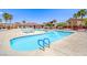 Resort-style community pool with lounge chairs and a spacious deck area at 3696 Via Geneva, Henderson, NV 89052
