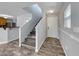 Bright entryway features wood-look flooring, stairs to the second floor, and a white front door at 3696 Via Geneva, Henderson, NV 89052
