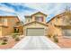 Charming two-story home with a well-manicured lawn and a spacious two-car garage at 3696 Via Geneva, Henderson, NV 89052