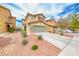 Charming two-story home with a well-manicured lawn and a spacious two-car garage at 3696 Via Geneva, Henderson, NV 89052