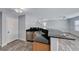 Bright kitchen and living area featuring granite countertops, stainless steel appliances, and modern flooring at 3696 Via Geneva, Henderson, NV 89052