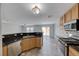 Open concept kitchen with stainless steel appliances, granite countertops, and seamless flow to living spaces at 3696 Via Geneva, Henderson, NV 89052
