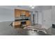 Bright kitchen featuring granite countertops, stainless steel appliances, light wood cabinets, and modern flooring at 3696 Via Geneva, Henderson, NV 89052