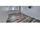 Large open area featuring fresh paint, modern flooring, and lots of natural light at 3696 Via Geneva, Henderson, NV 89052