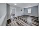 Upstairs living area featuring fresh paint, modern flooring and natural light at 3696 Via Geneva, Henderson, NV 89052