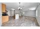 Expansive living space with wood-look floors, granite countertops, and modern lighting fixtures at 3696 Via Geneva, Henderson, NV 89052