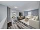 Cozy loft space with hardwood floors and neutral tones; ideal for relaxation and recreation at 3696 Via Geneva, Henderson, NV 89052