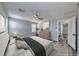 Serene bedroom featuring plush carpeting, a ceiling fan, and ample natural light at 3696 Via Geneva, Henderson, NV 89052
