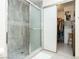 Bathroom featuring a standing shower with a glass door and open closet space at 4567 Madreperla St, Las Vegas, NV 89121
